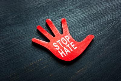 Graphic of hand stopping hate