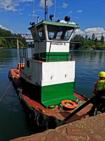 The "Rainbow B" tugboat that once towed log rafts along the Willamette River.