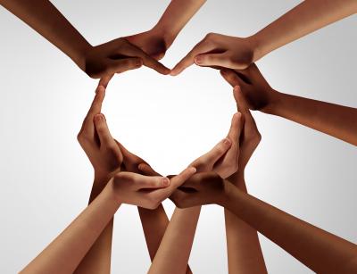 Multi-racial hands in shape of a heart