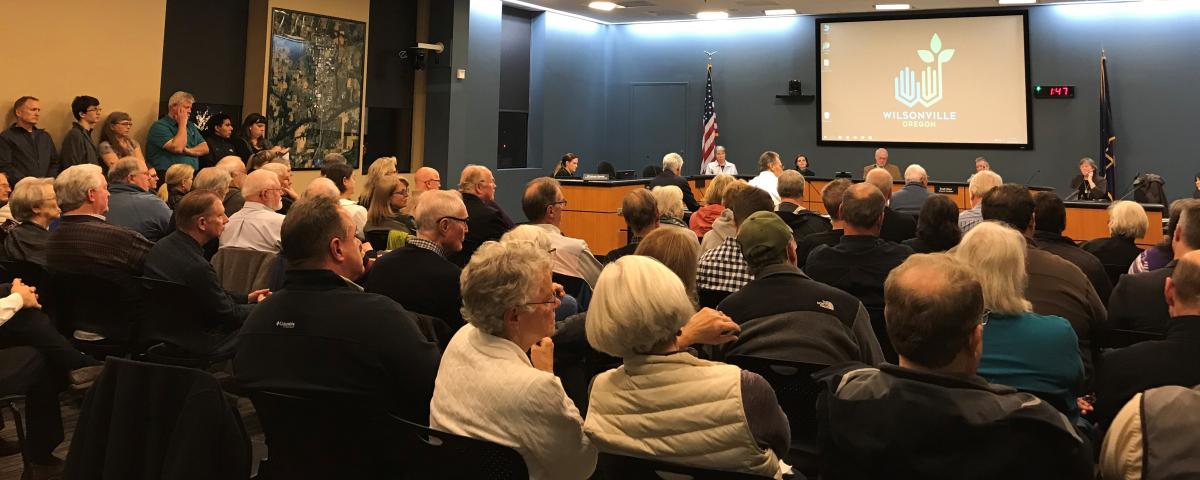 City Council Chambers packed for public forum on Aurora State Airport runway extension